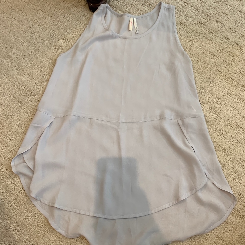 grey sleeveless blouse